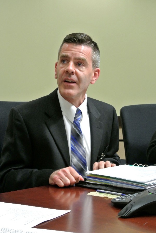 Paul Reimers, incoming chapter president, addresses the board after his induction ceremony in July.